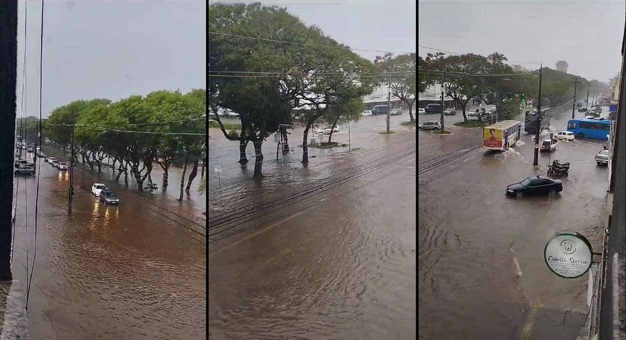 Vídeo de autoria indeterminada, compartilhado em grupos de WhatsApp, mostra a Avenida JK inundada no cruzamento com a Avenida Carlos Gomes, na Vila Portes.